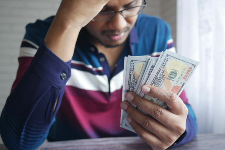 Young black man stressed about money